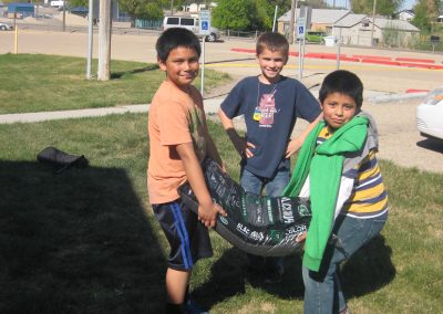 Husky Pride 4-H Club members providing the muscle to bring in the mulch for the project!